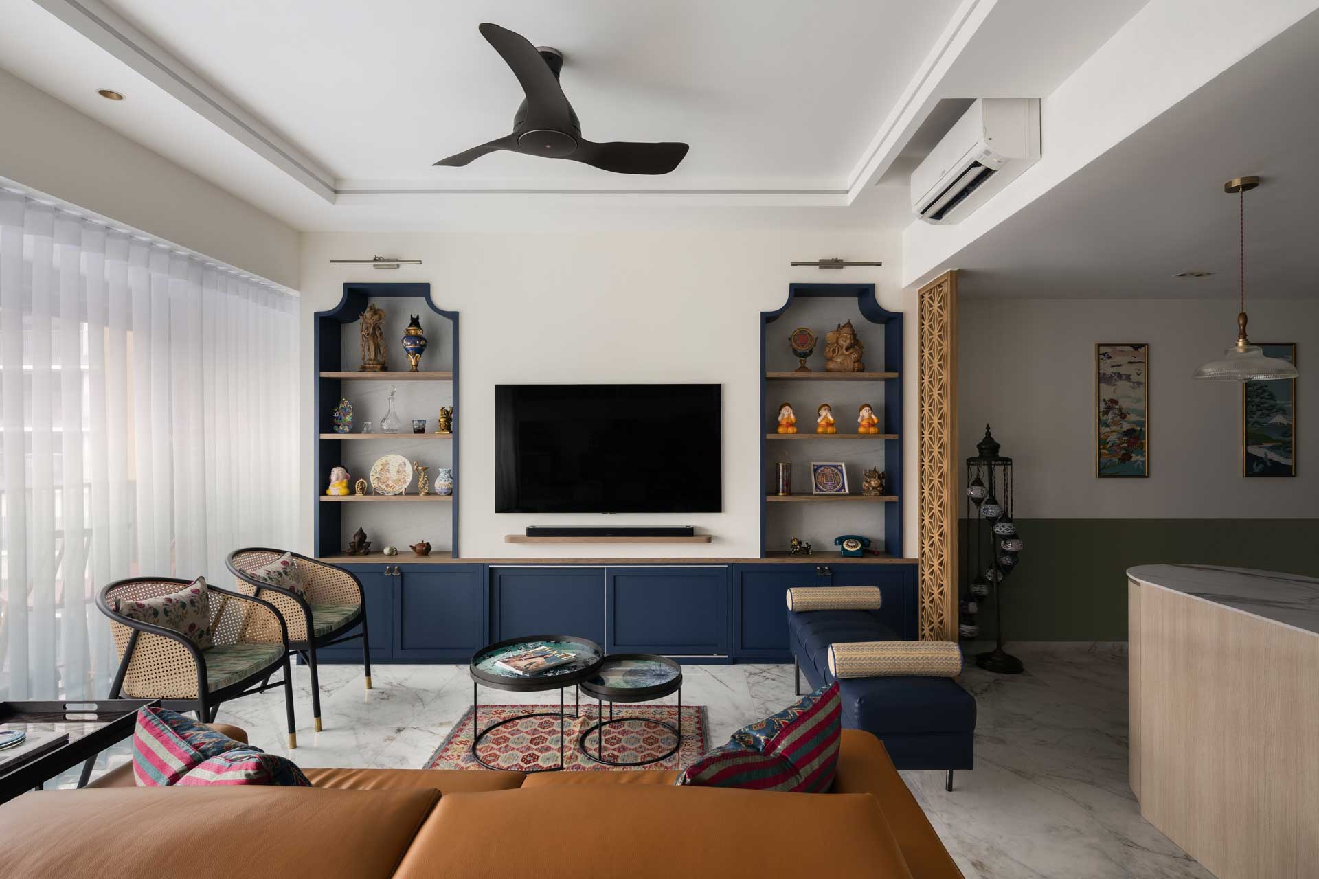 Renovation interior design featuring eclectic vintage style with blue accents in the living room at Coco Palms